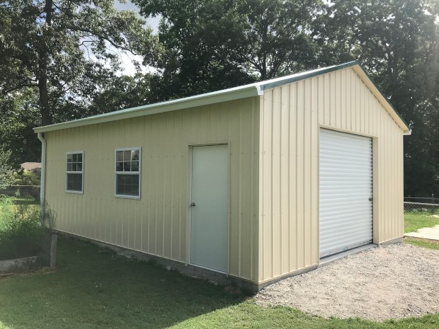 Vertical siding, one 9x8 roll-up door, six windows, one entry door, insulation on roof and walls, two gutters and downspouts